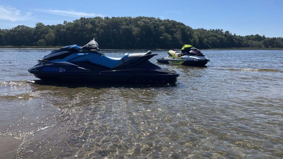 Both Live Free Jet Ski Sea-Doo jet skis on a New Hampshire lake