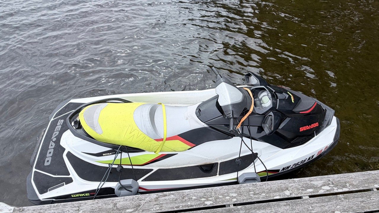 Sea-Doo Wake 155 moored alongside a dock with tie-down lines